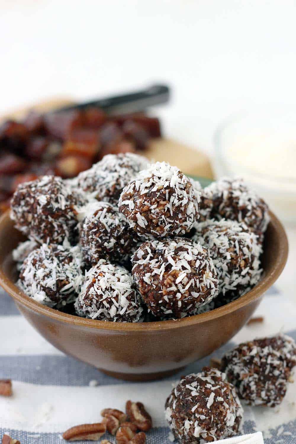 These Whole30 / Paleo chocolate coconut energy balls are an amazing midday snack and energy boost! Sweetened only with dates and super easy to make, they taste decadent, similar to an almond joy, but are 100% guilt-free.