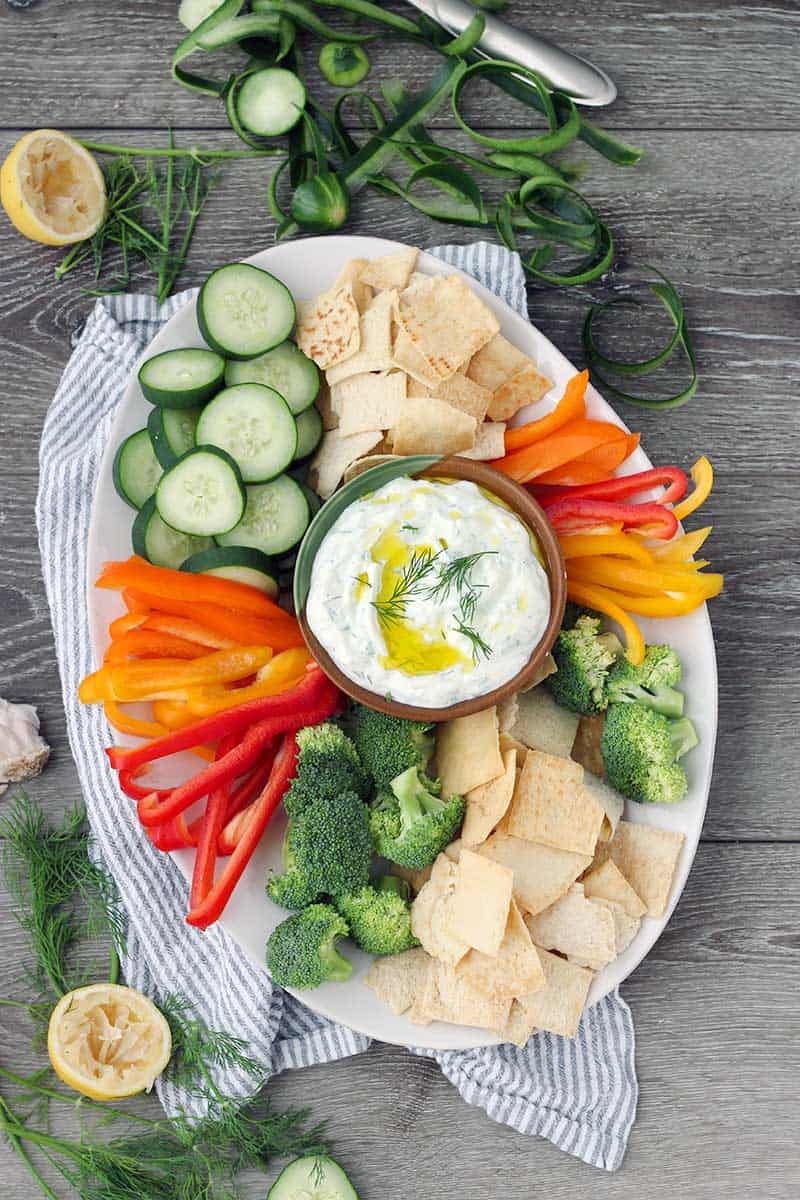 This Authentic Tzatziki Sauce (Greek Cucumber Yogurt Sauce) is SO easy to make! Use as a dip, as a spread on sandwiches or gyros, or mix into chicken or tuna salad.