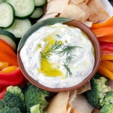 This Authentic Tzatziki Sauce (Greek Cucumber Yogurt Sauce) is SO easy to make! Use as a dip, as a spread on sandwiches or gyros, or mix into chicken or tuna salad.