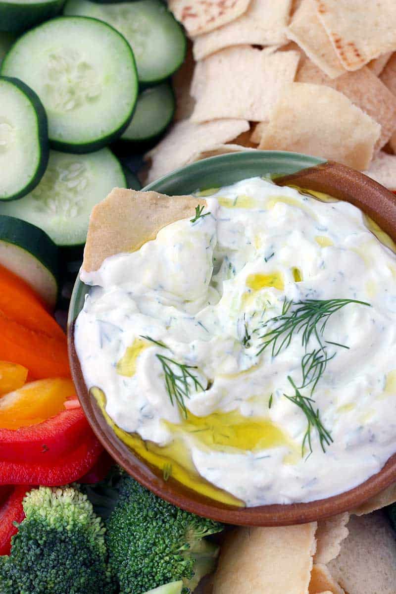 This Authentic Tzatziki Sauce (Greek Cucumber Yogurt Sauce) is SO easy to make! Use as a dip, as a spread on sandwiches or gyros, or mix into chicken or tuna salad.