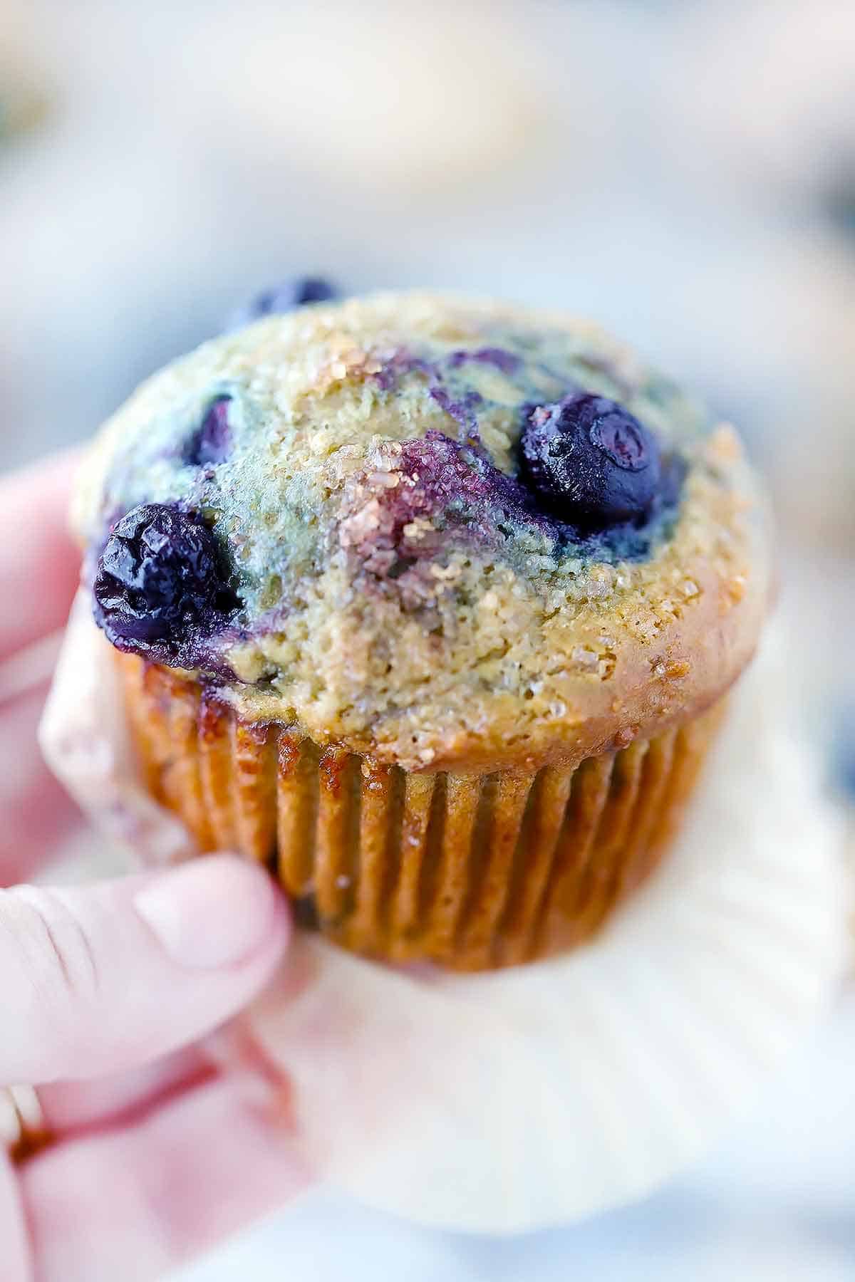 Close up photo of a blueberry muffin made with olive oil.