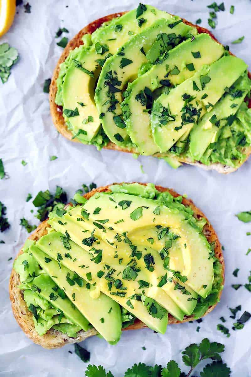 Overhead photo of two slices of avocado toast.