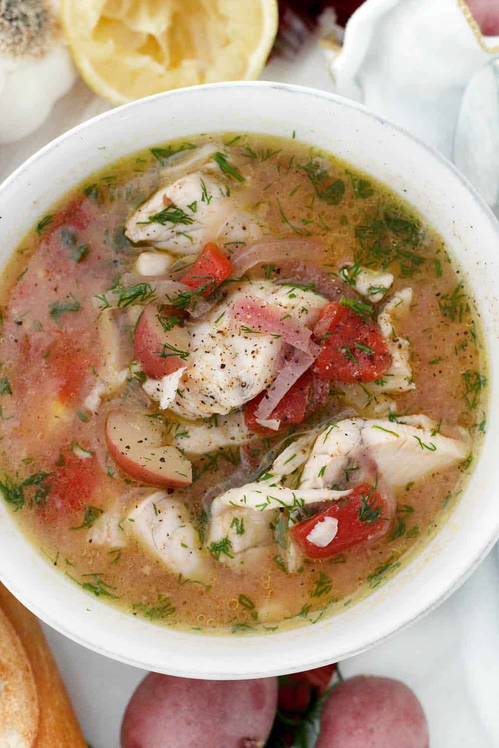 This Instant Pot Fish Stew is a delicious Mediterranean recipe year-round. It features sea bass, potatoes, and tomatoes, and it's flavored with fresh lemon juice, dill, and extra-virgin olive oil. It only takes 20 minutes to make in a pressure cooker!