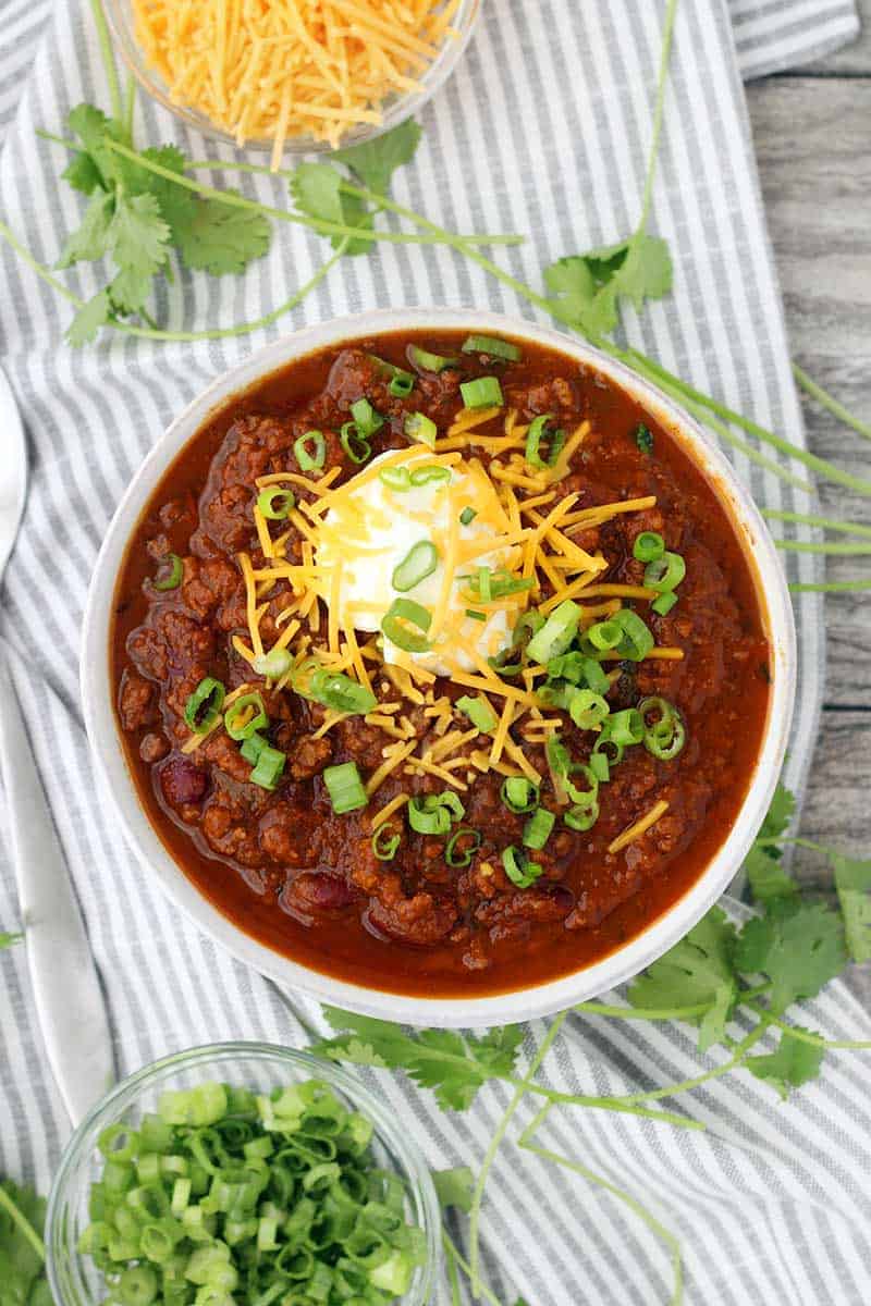 Instant Pot Pumpkin Chili is so easy to make and packed with fall flavors from pumpkin pie spices and apple cider! This recipe uses a whole can of pumpkin and is slightly sweet, slightly spicy, and tastes smooth and velvety.