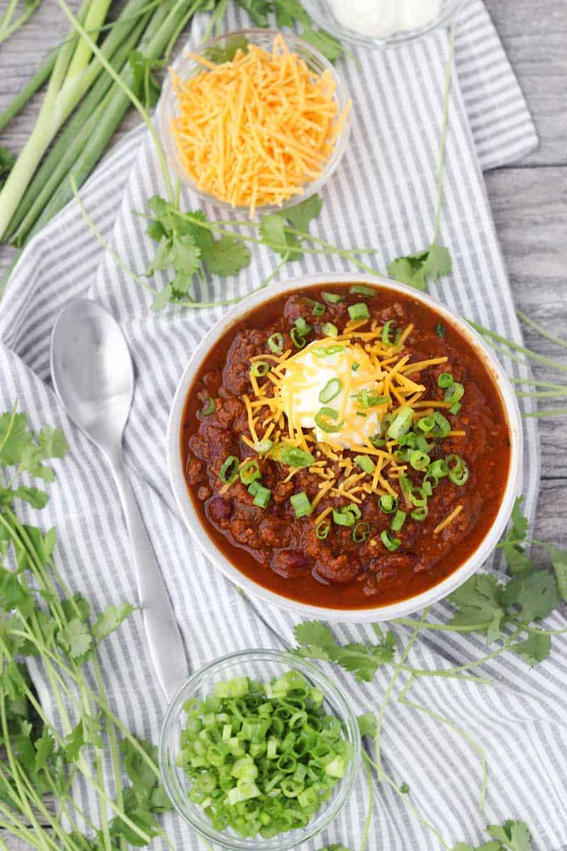 Instant Pot Pumpkin Chili is so easy to make and packed with fall flavors from pumpkin pie spices and apple cider! This recipe uses a whole can of pumpkin and is slightly sweet, slightly spicy, and tastes smooth and velvety.