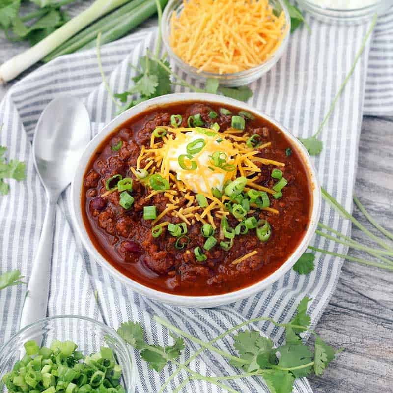 Instant Pot Pumpkin Chili is so easy to make and packed with fall flavors from pumpkin pie spices and apple cider! This recipe uses a whole can of pumpkin and is slightly sweet, slightly spicy, and tastes smooth and velvety.