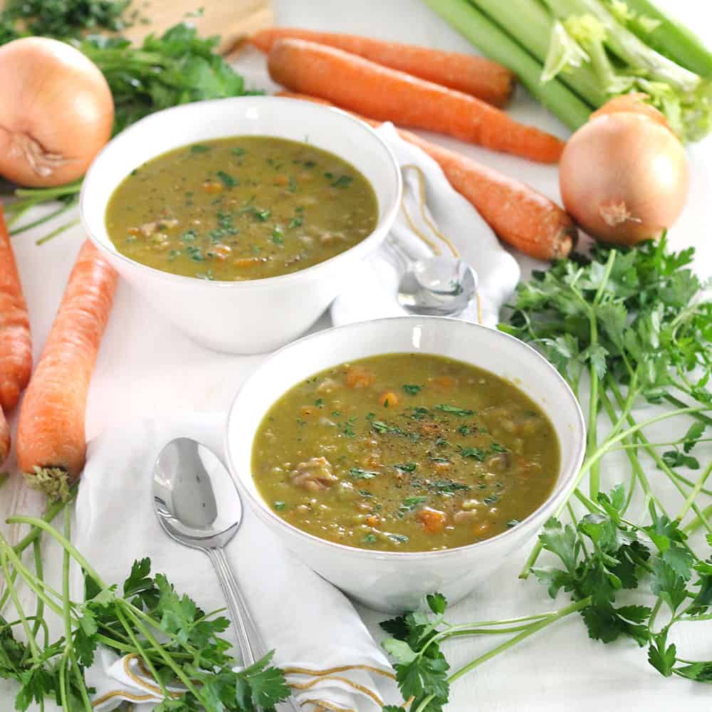 This Instant Pot Split Pea Soup is made with a leftover ham bone (or any ham you have), for a super easy, freezable weeknight meal! The pressure cooker cuts the cooking time in half. #InstantPot #splitpeasoup #PressureCooker