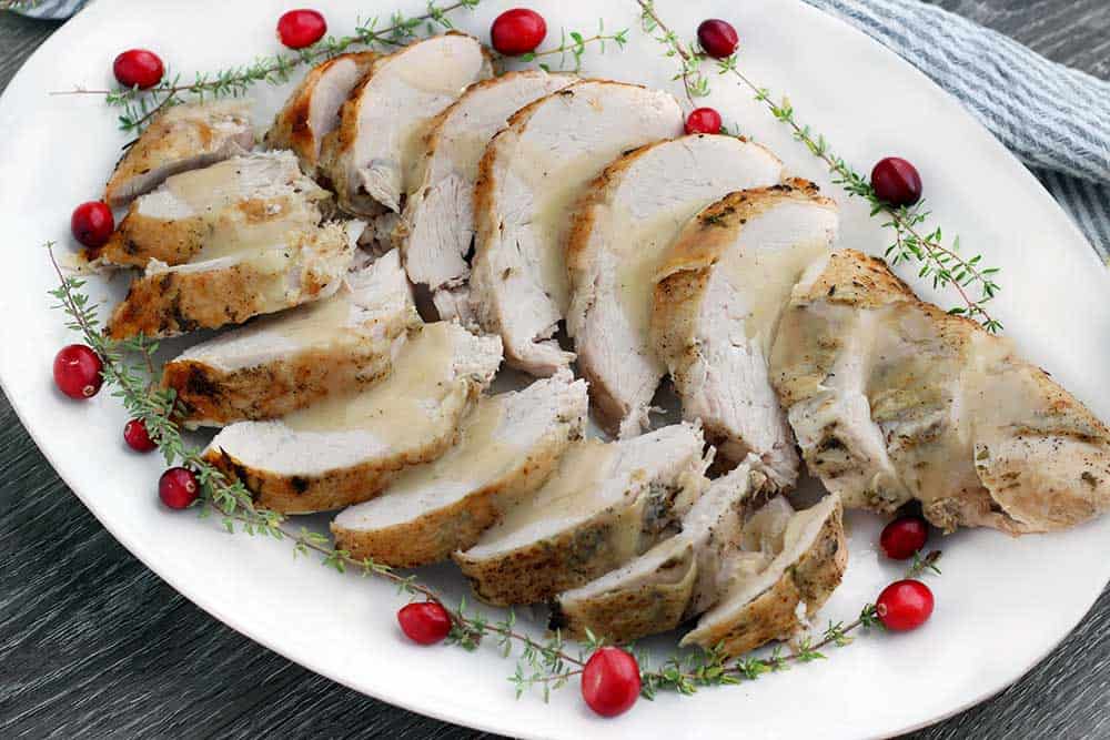 This Instant Pot Turkey Breast with Lemon and Thyme is a Thanksgiving game changer! Cook the whole thing in under an hour for juicy, tender bone-in, skin-on turkey breast.
