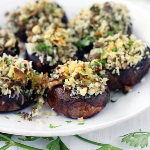 These Italian Vegetarian Stuffed Mushrooms are a great make-ahead recipe for dinner or an appetizer! They're packed with flavor from the fresh herbs, shallots, garlic, and parmesan cheese.