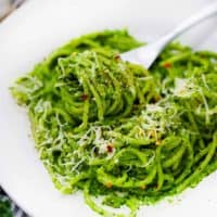 square image of spaghetti with kale pesto.