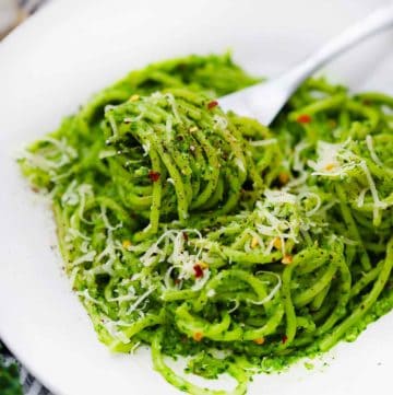 square image of spaghetti with kale pesto.