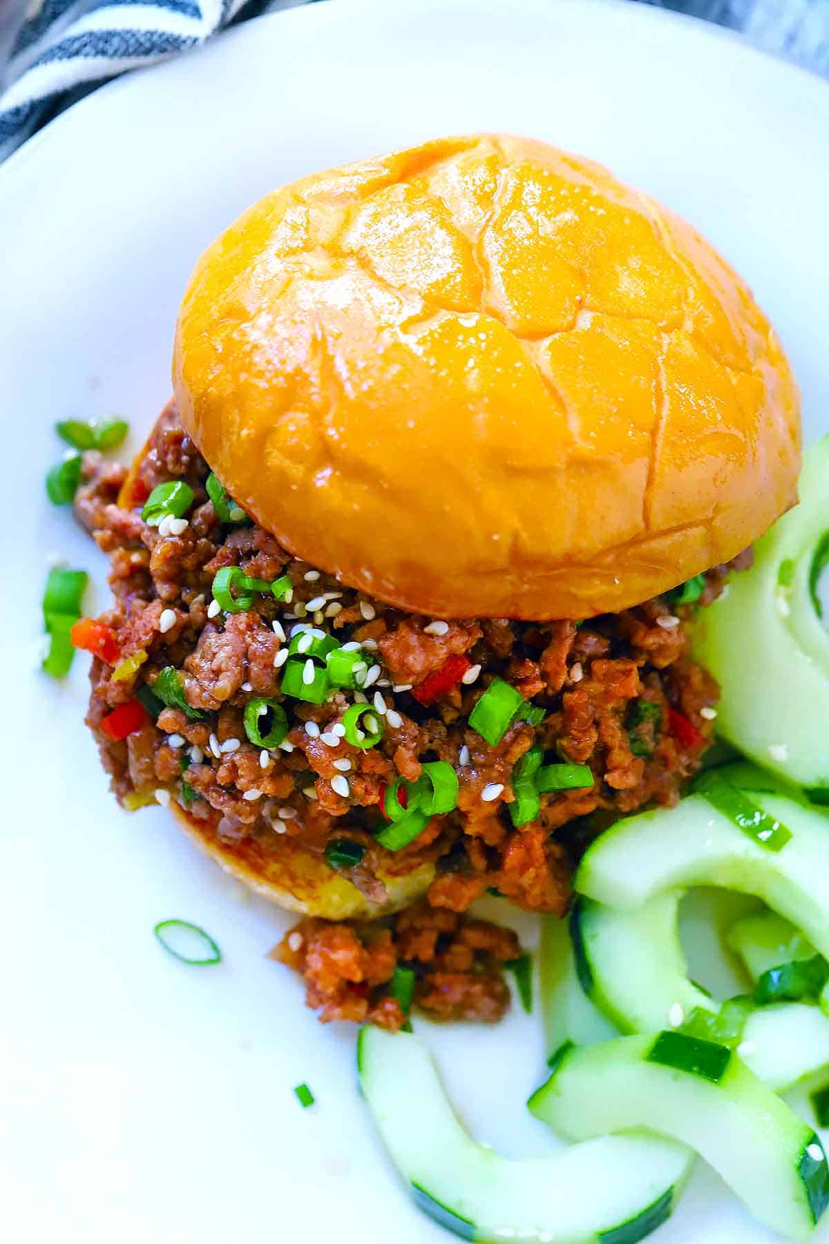 Overhead close up photo of a korean bbq sloppy joe sandwich.