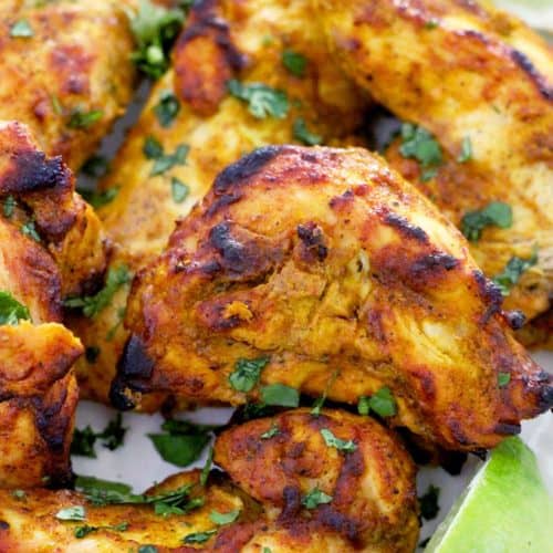 This Oven Broiled Tandoori Chicken is super flavorful, charred, and smoky- just like at your favorite Indian restaurant! This healthy, low carb recipe takes only 20 minutes to cook and is perfect on its own or in your favorite Indian chicken dish.