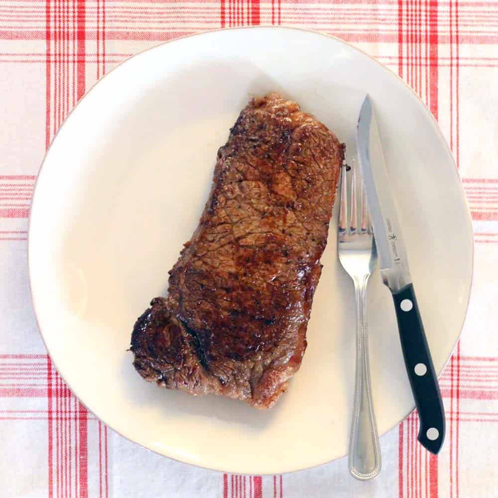 Make the most PERFECT tender, melt-in-your-mouth steak with these 9 easy steps/tricks, with a rich browned butter pan sauce drizzled on top. Paleo and Whole30 approved!