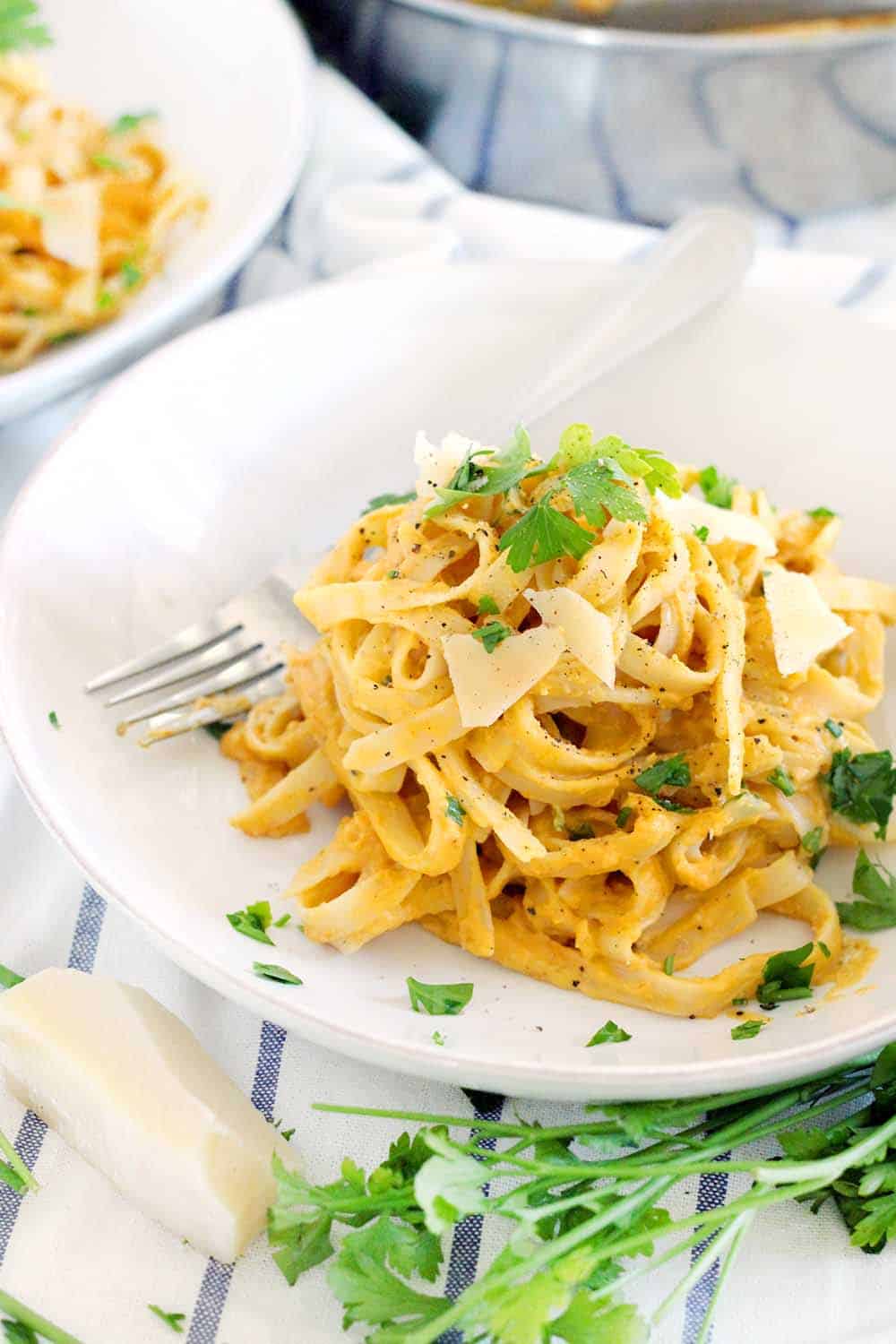 With 60% fewer calories than traditional Alfredo sauce, this Pumpkin Fettucini Alfredo is healthy, creamy, and delicious. It's a great way to sneak veggies into a main course, especially in the fall season!