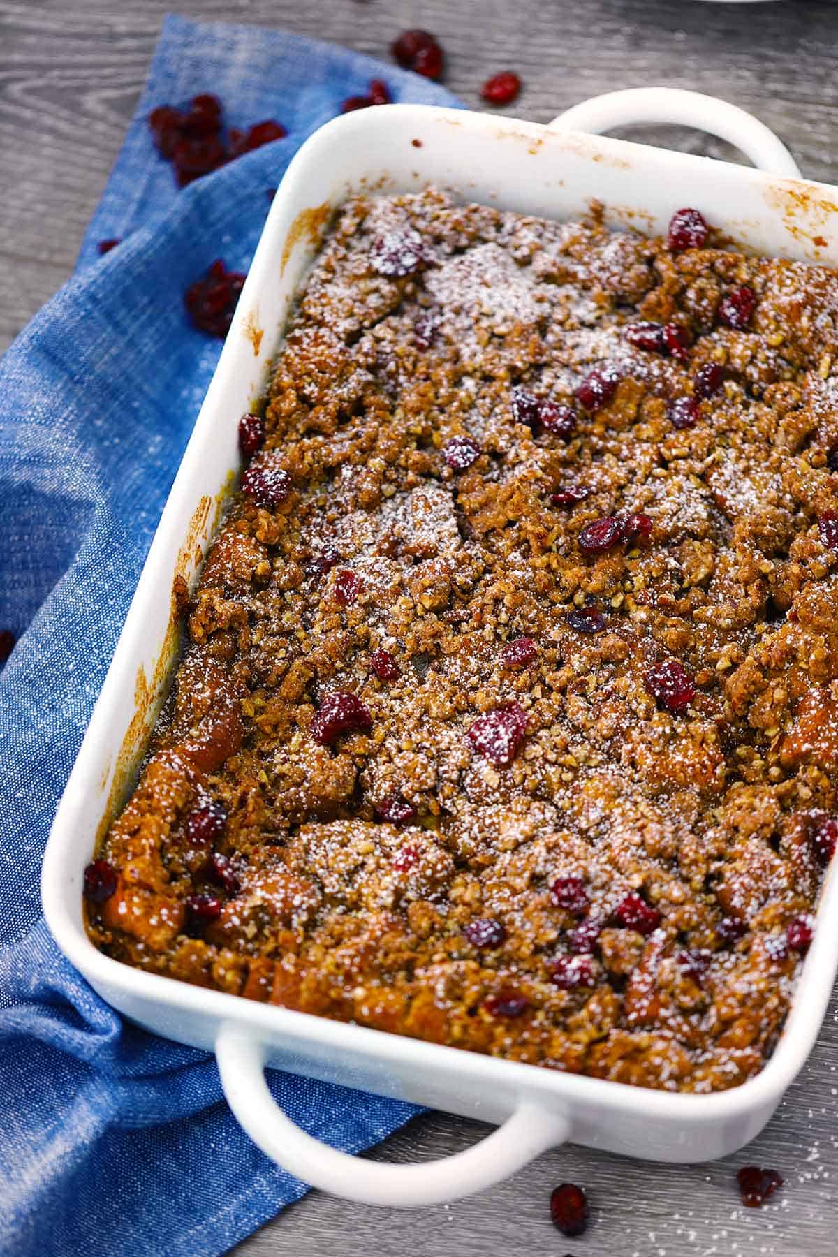 Baked pumpkin french toast casserole in a baking dish.