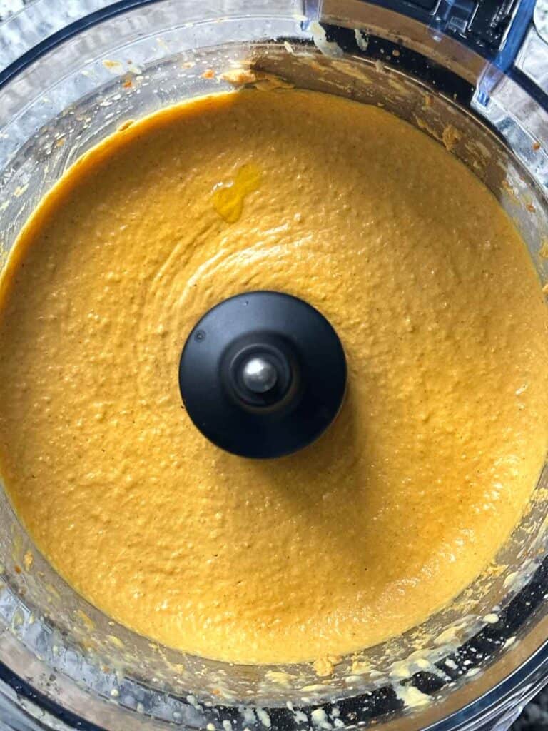 Pumpkin hummus in a food processor.