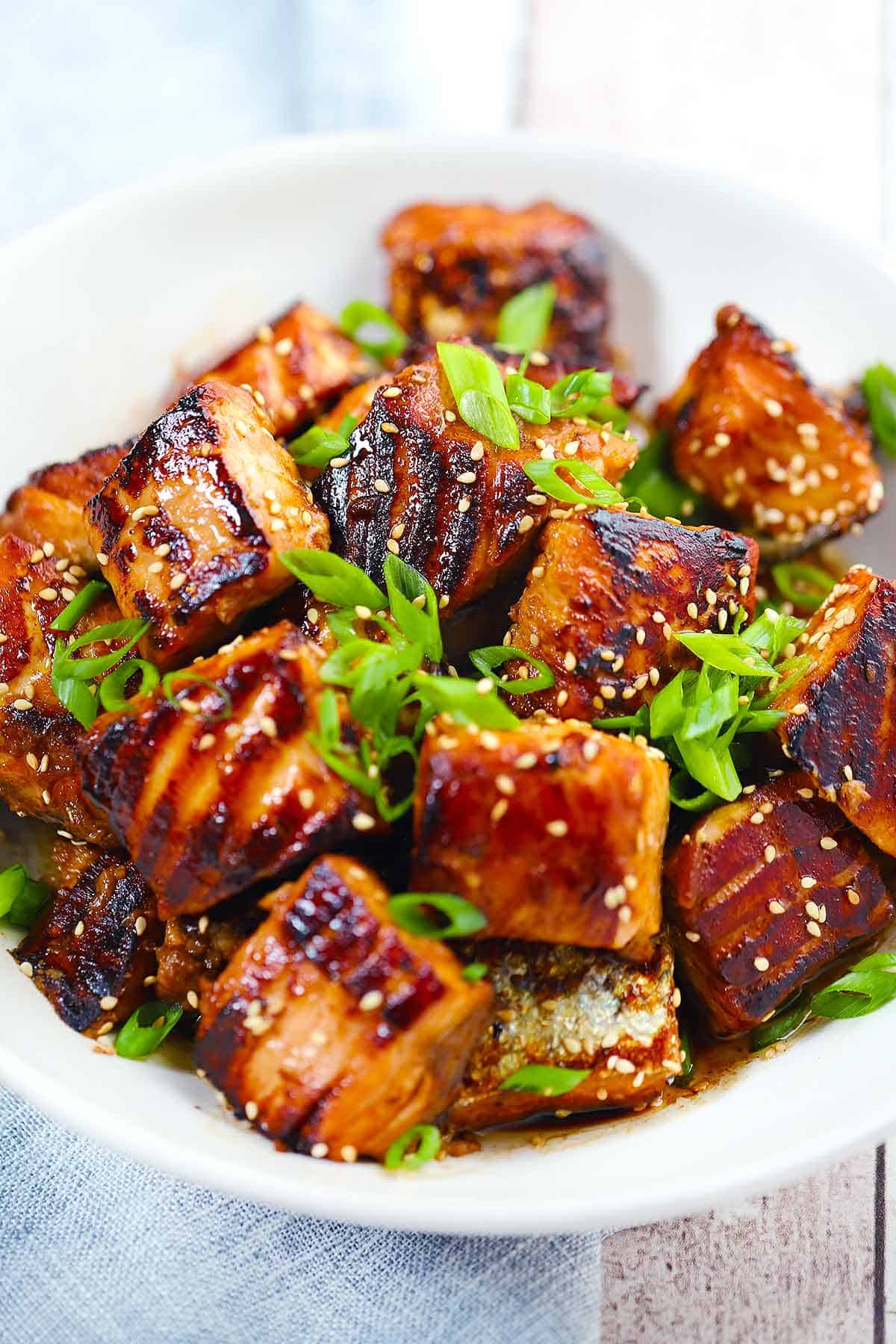 A bowl of pan-fried salmon bites.