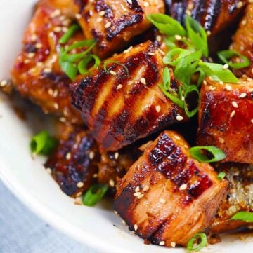 Square photo of salmon bites close up.