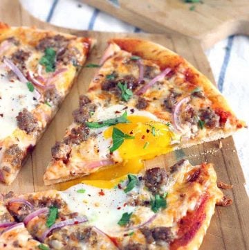 Pizza for breakfast?! Just put eggs on it! This Sausage Breakfast Pizza recipe is perfect for brunch and takes only 20 minutes to make. Use a cast iron pizza pan for best results.