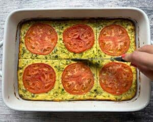 Cutting a Greek Zucchini Casserole (Sfougato) into six pieces.