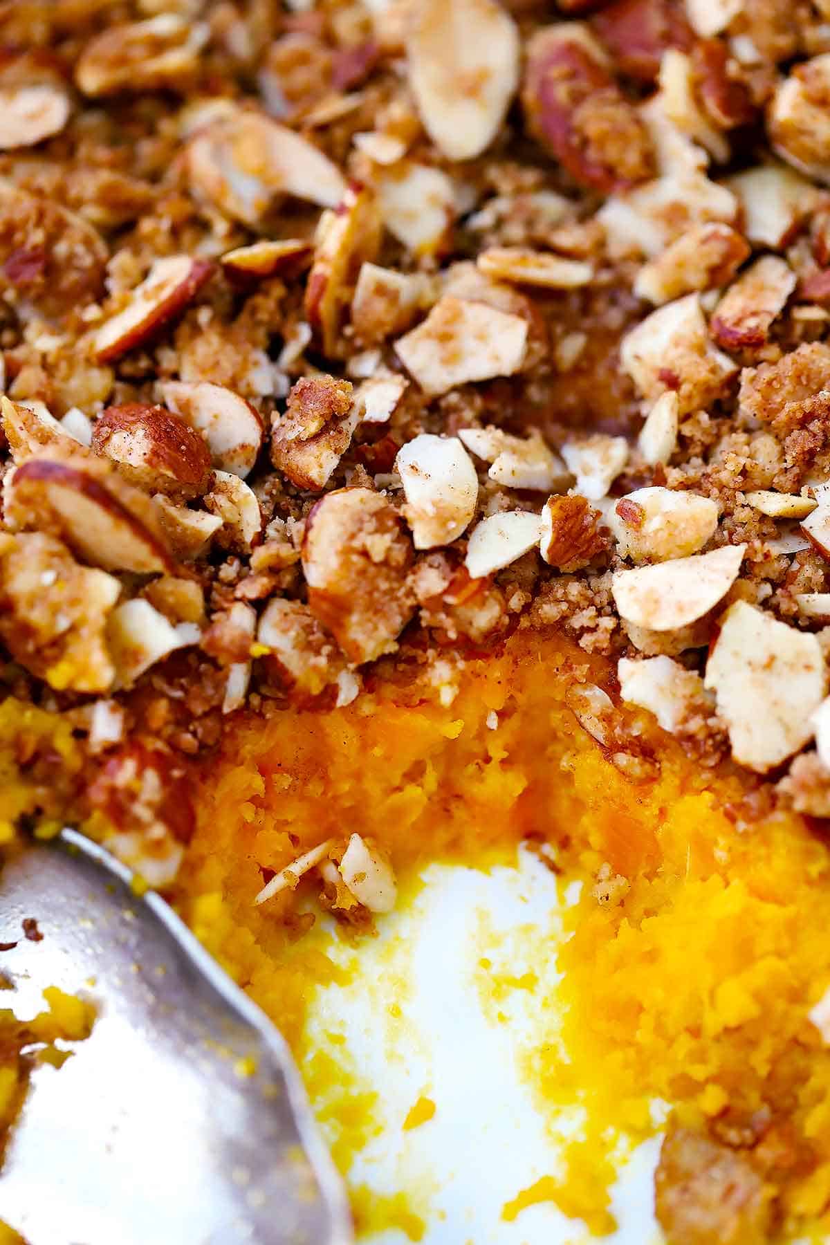 Close up photo of sweet potato casserole with streusel topping.