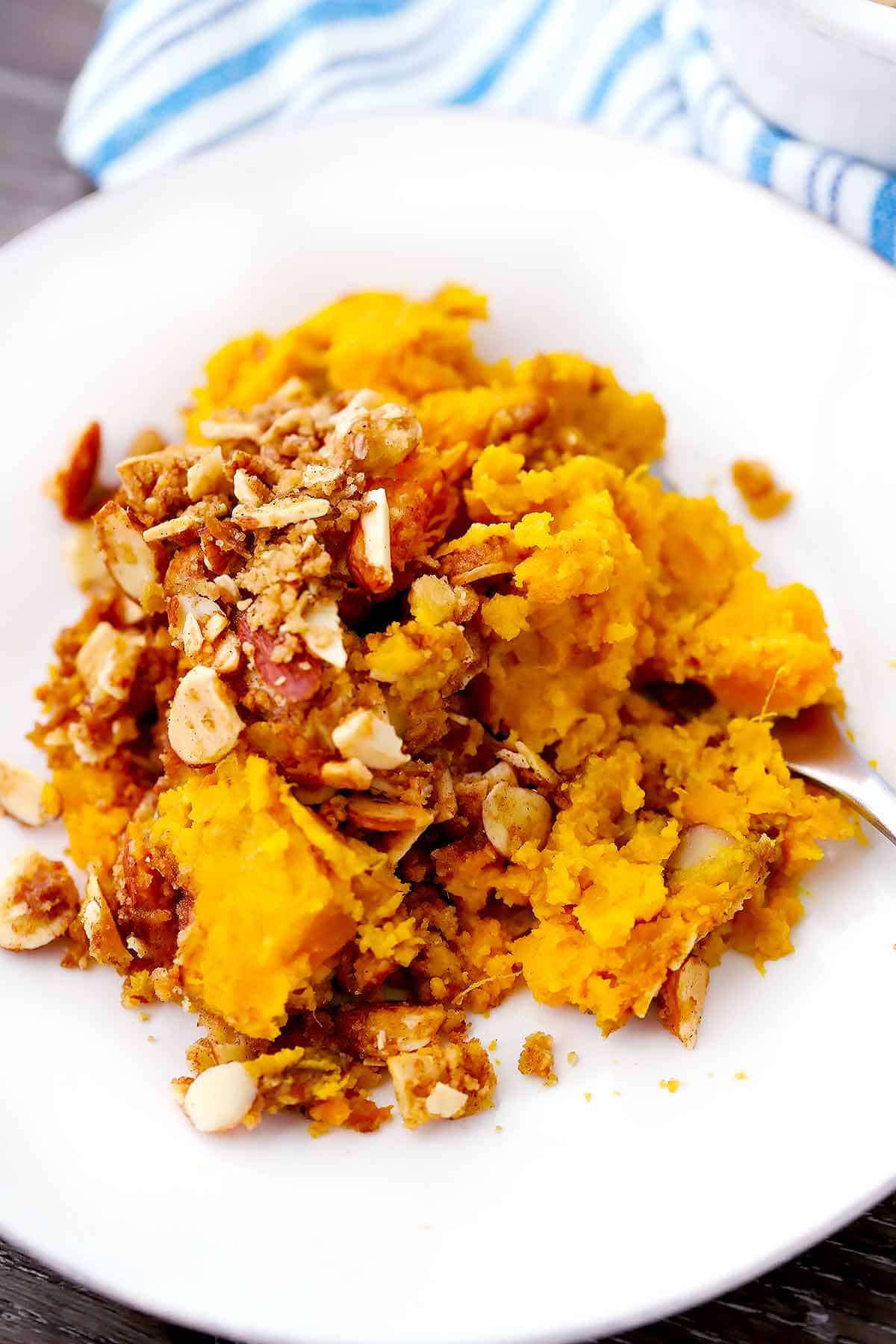 A white plate with sweet potato casserole.