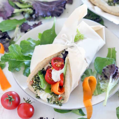 These are the ULTIMATE vegetarian pita sandwiches (vegan optional), piled high with hummus, tabbouleh, dill yogurt sauce, pickled veggies, greens, and tomatoes. Make in advance for lunch all week! #mealprep #vegetarian #sandwiches