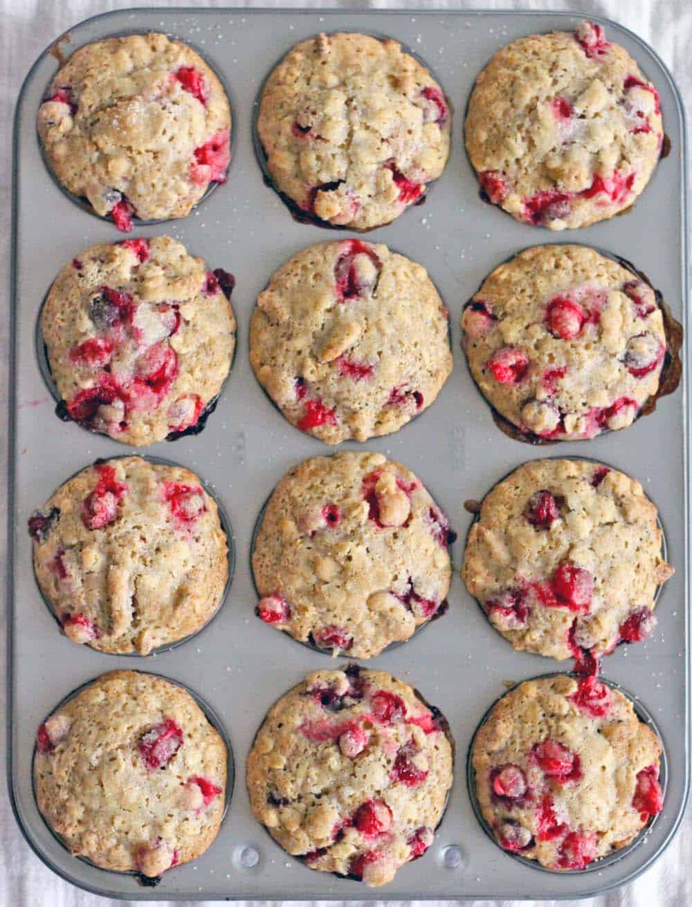 These whole wheat cranberry ginger pecan muffins are healthy, hearty, and oh so tasty! Perfect for Christmas morning, using the leftover fresh cranberries from Thanksgiving you have stored in your freezer!