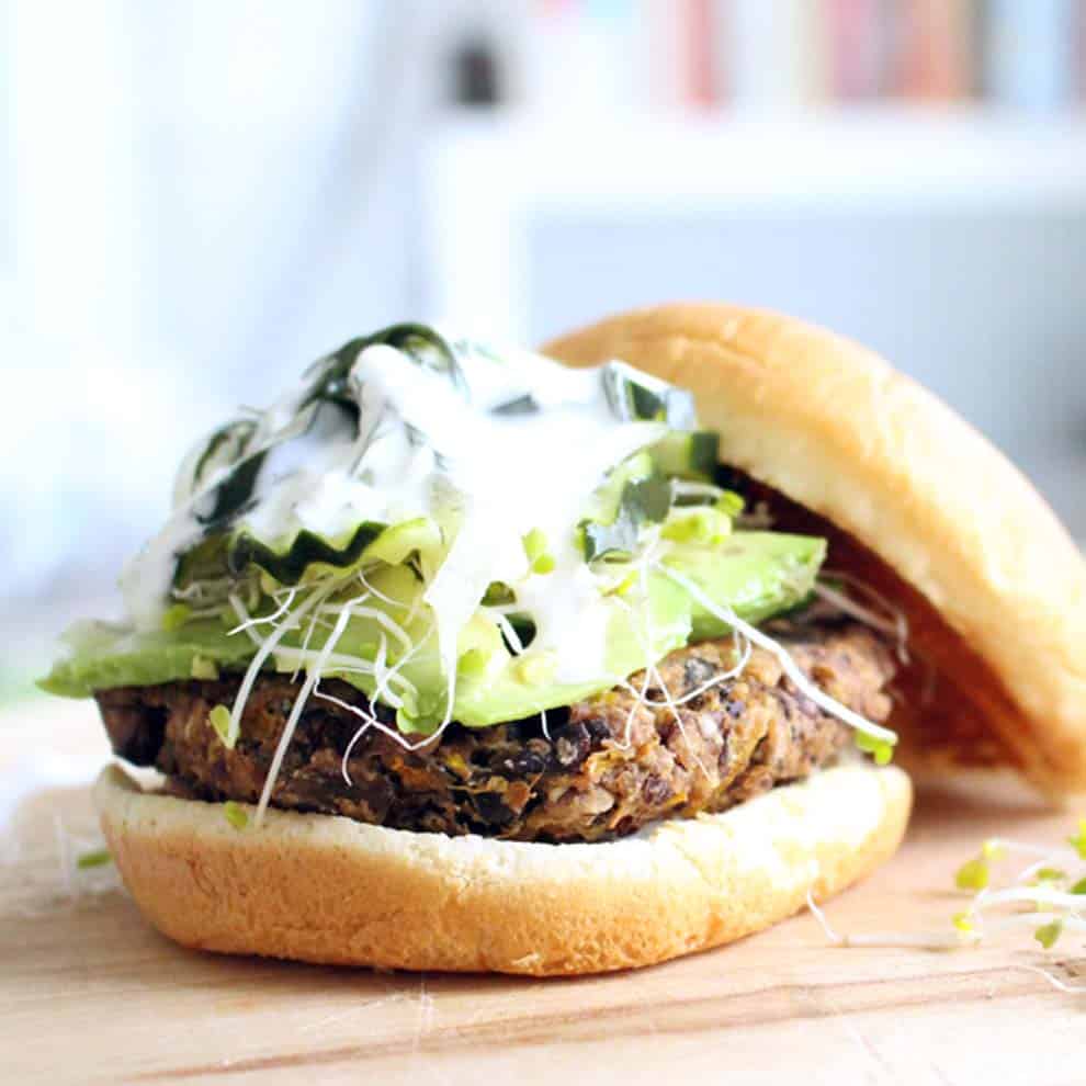 Wild Rice and Black Bean Veggie Burgers | Black beans are mixed with wild rice, eggs, bread crumbs, and spices to create a super flavorful, hearty burger. Freezable and DELICIOUS.
